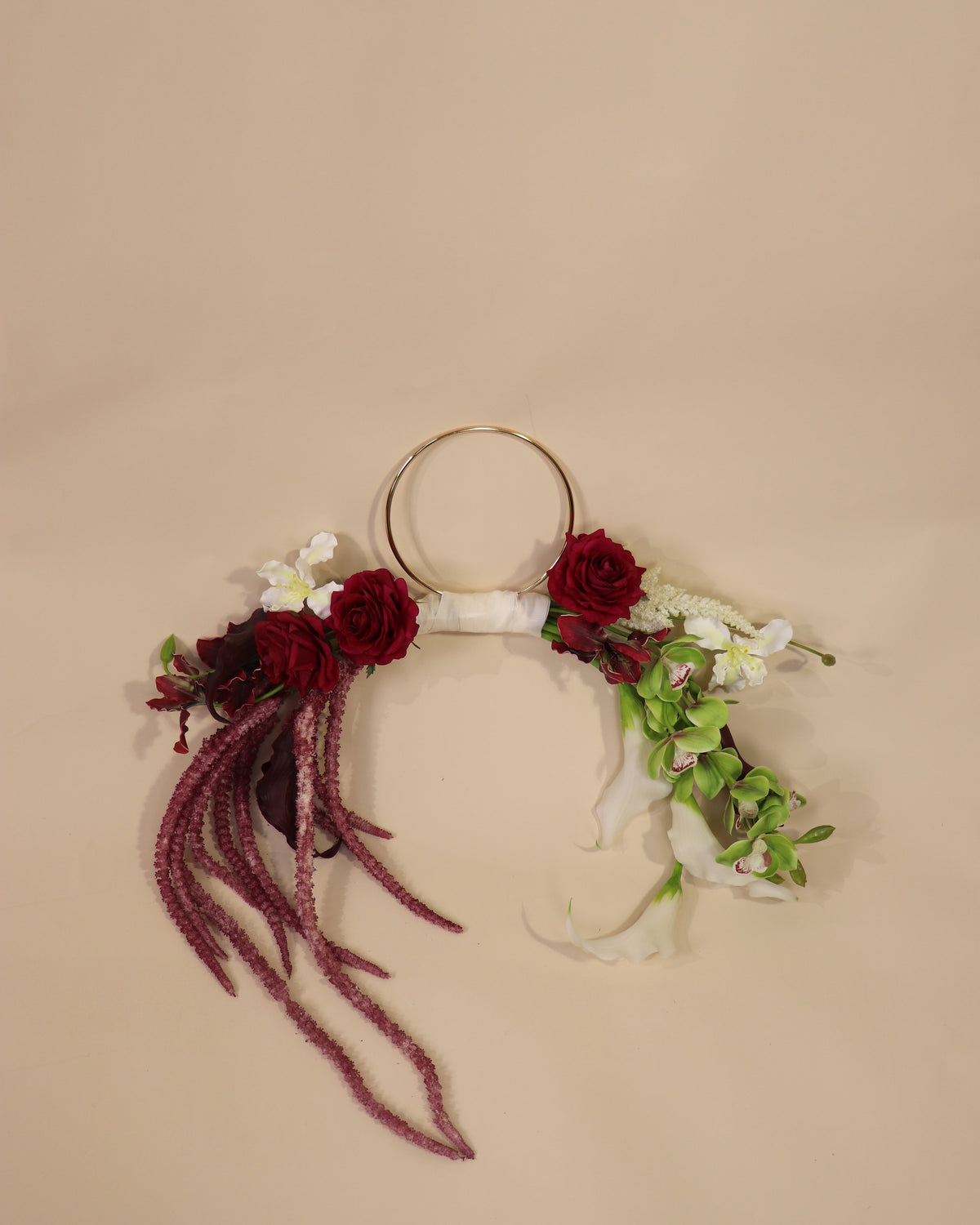 Burgundy Desire hoop bouquet featuring anthuriums, calla lilies and amaranth in rich burgundy tones with white and green accents.