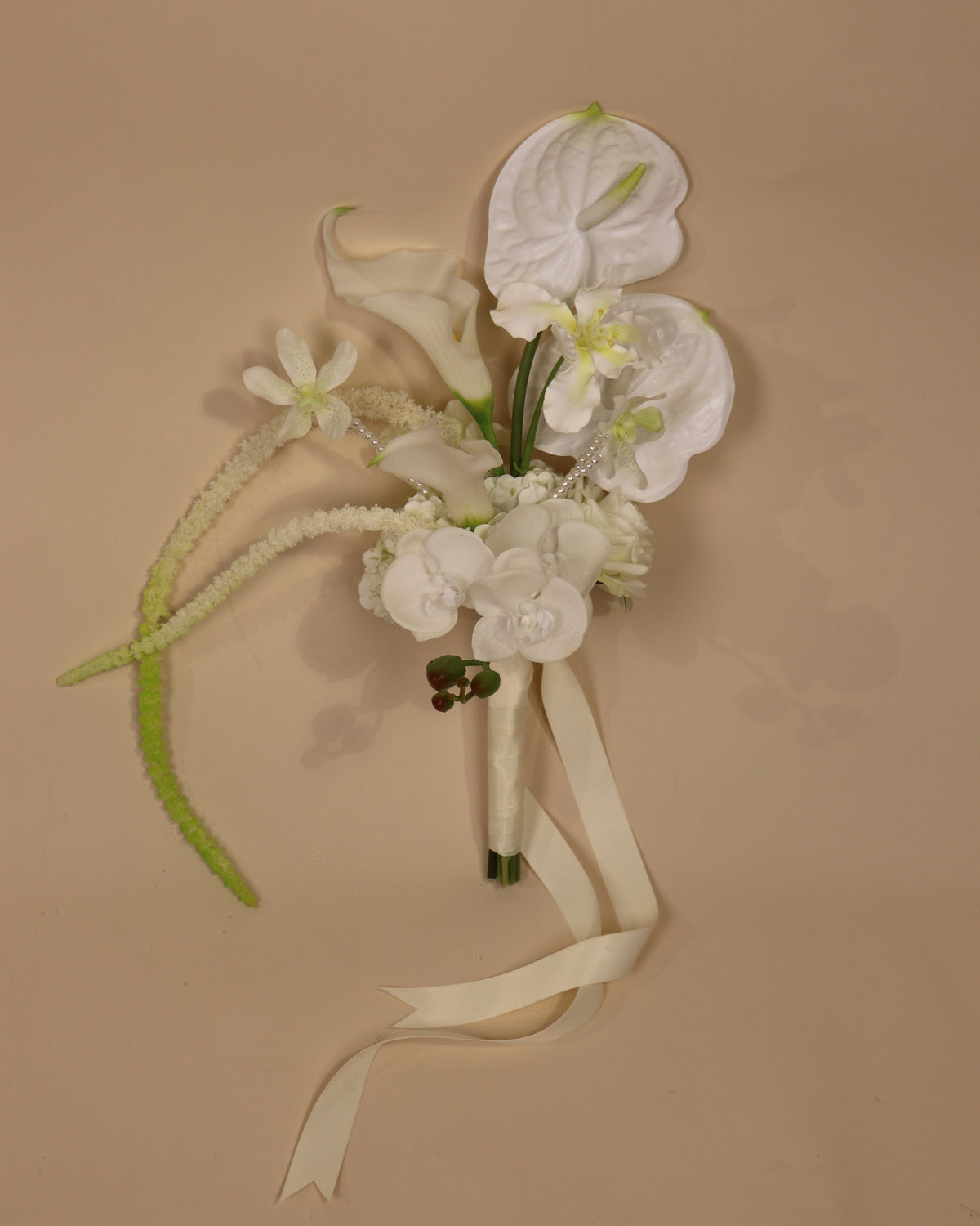 Pearl allure bridesmaid bouquet in beige background