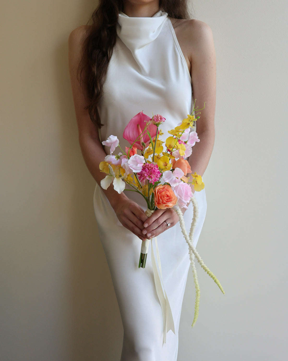 Tropical Punch bridal bouquet featuring bright, colourful real-touch flowers with satin ribbon-wrapped handle.