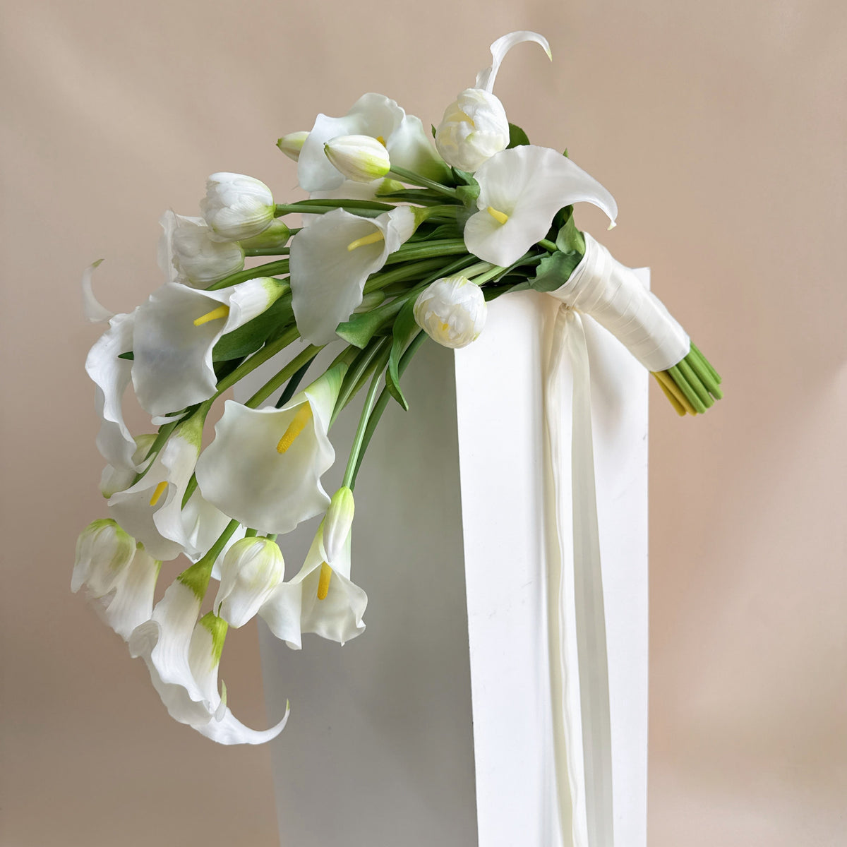 Cascading bridal bouquet with tulips and calla lilies