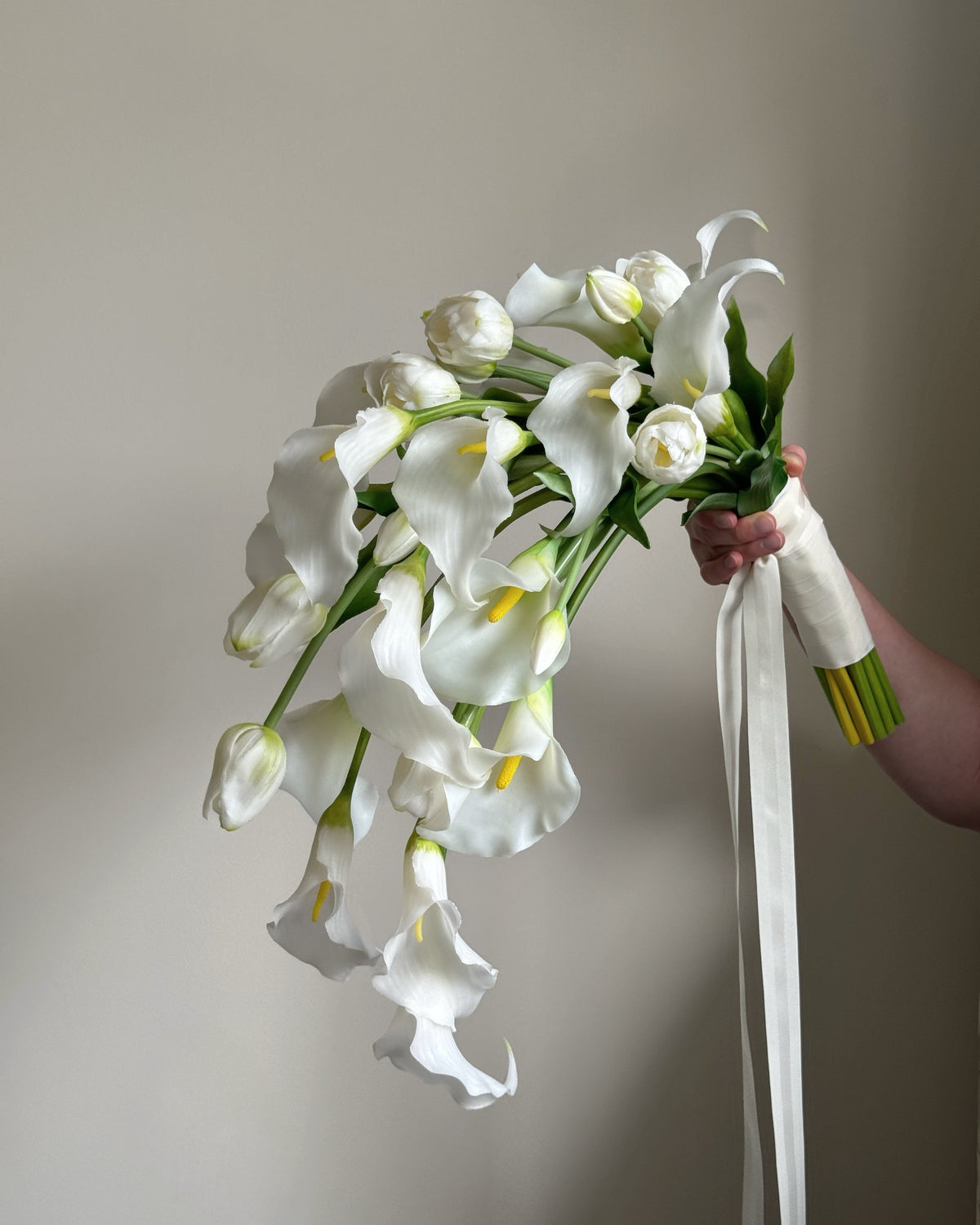 Cascading bridal bouquet with tulips and calla lilies