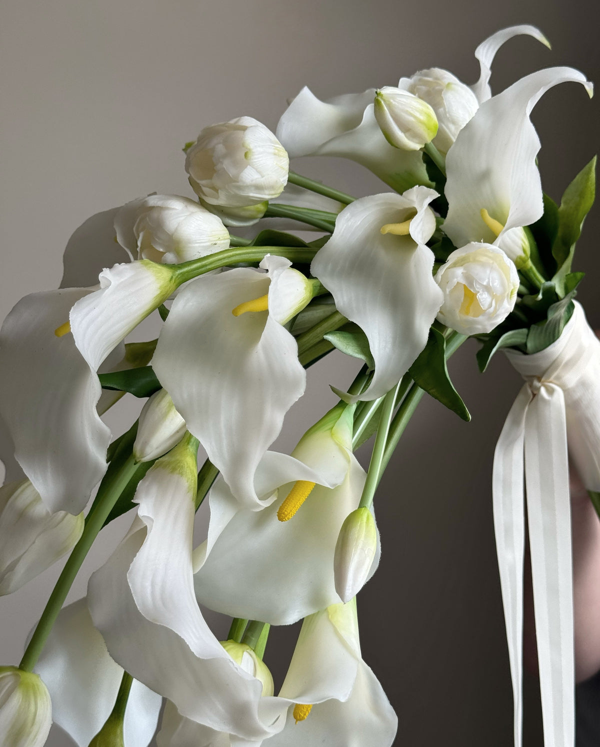 Cascading bridal bouquet with tulips and calla lilies
