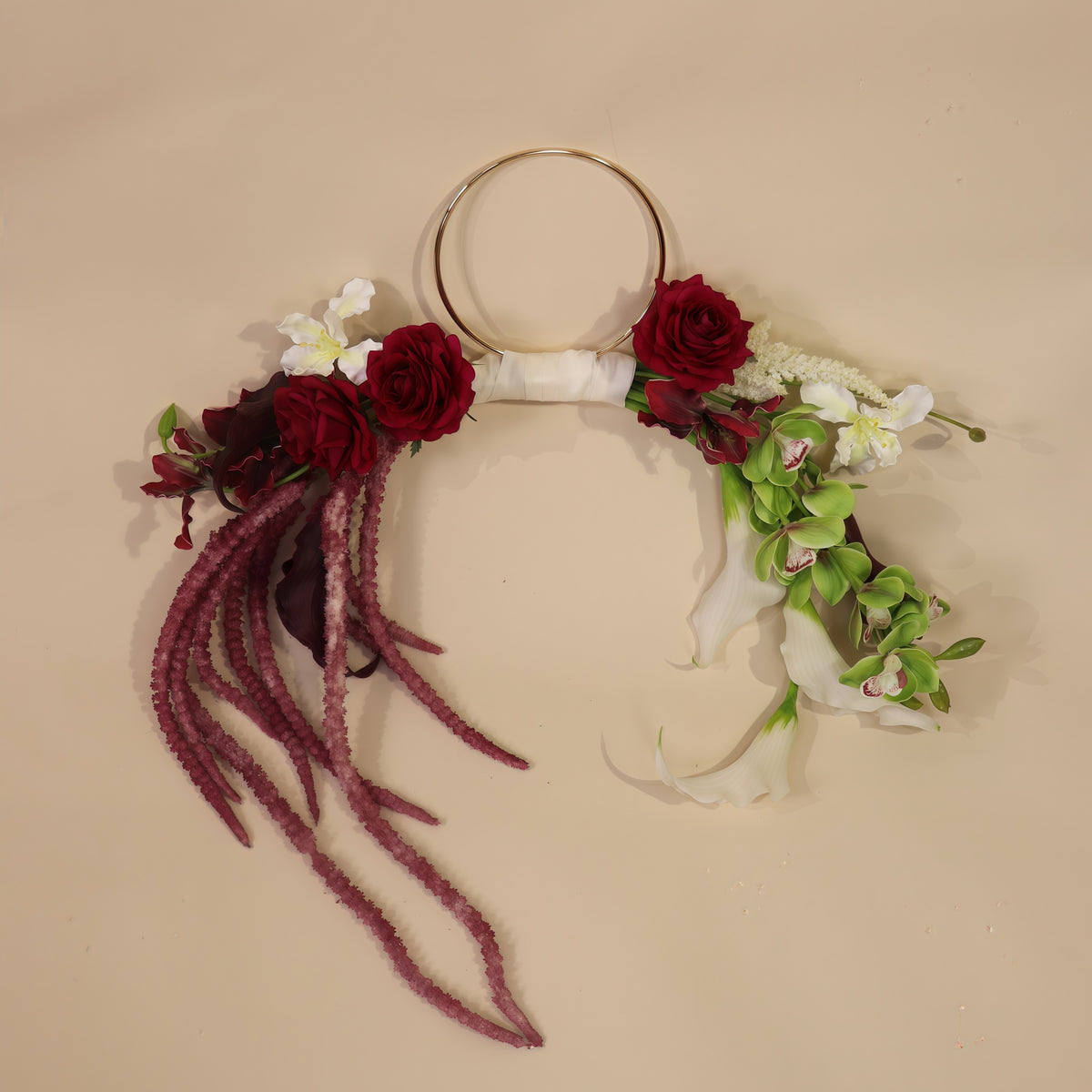 Burgundy Desire hoop bouquet featuring anthuriums, calla lilies and amaranth in rich burgundy tones with white and green accents.